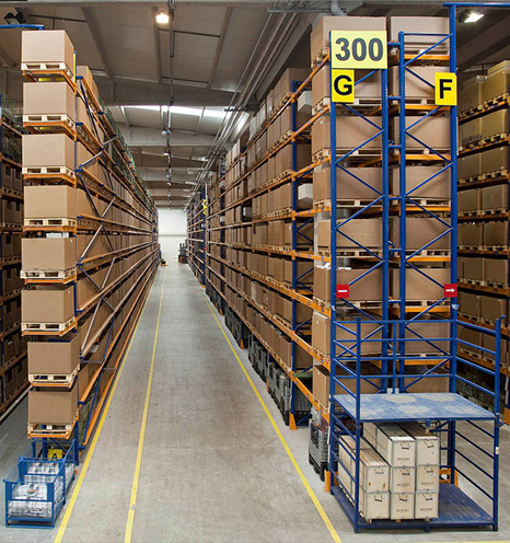 View of a warehouse with brown boxes on high shelving